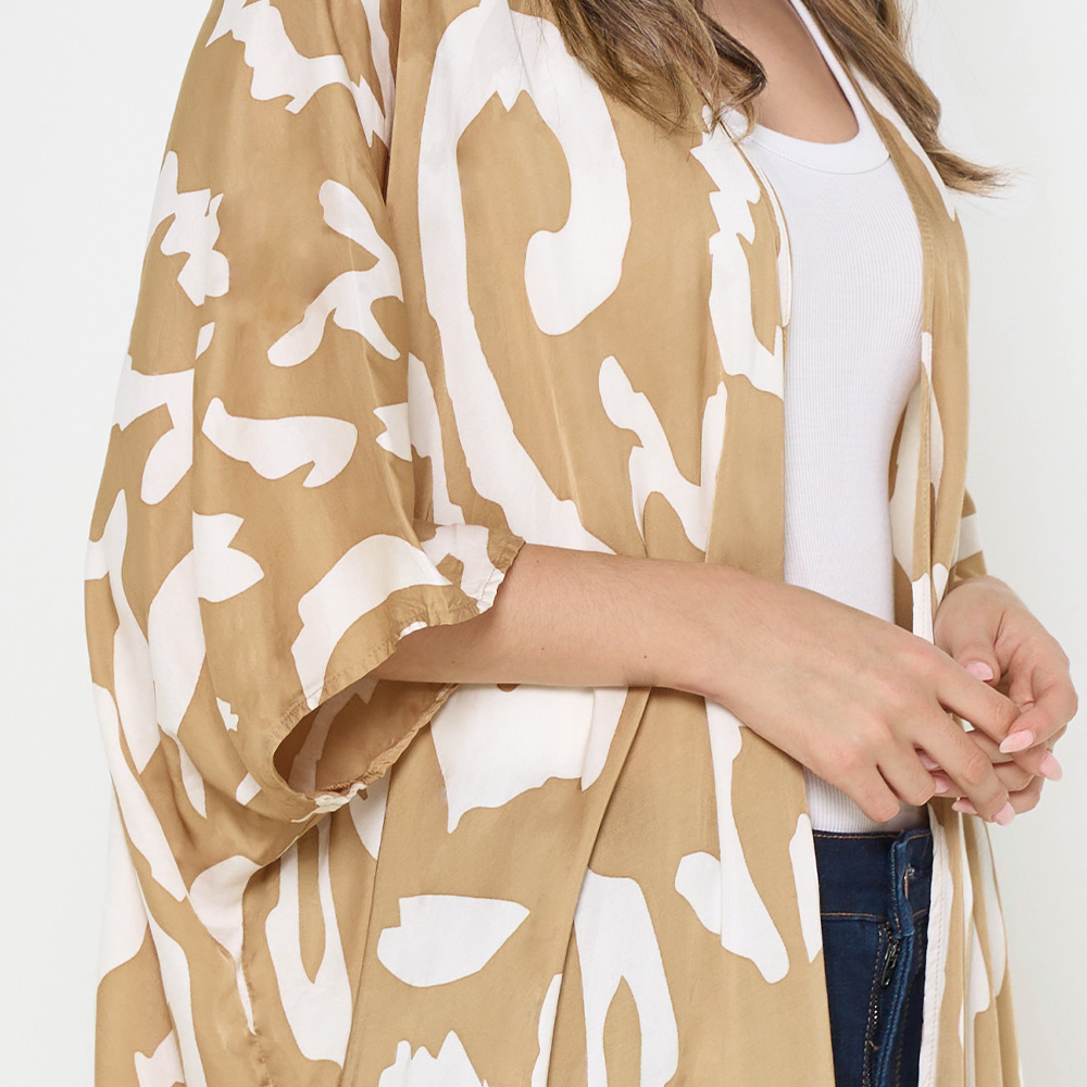 a closeup of the batik kimono in the pattern tan rimba against a white background