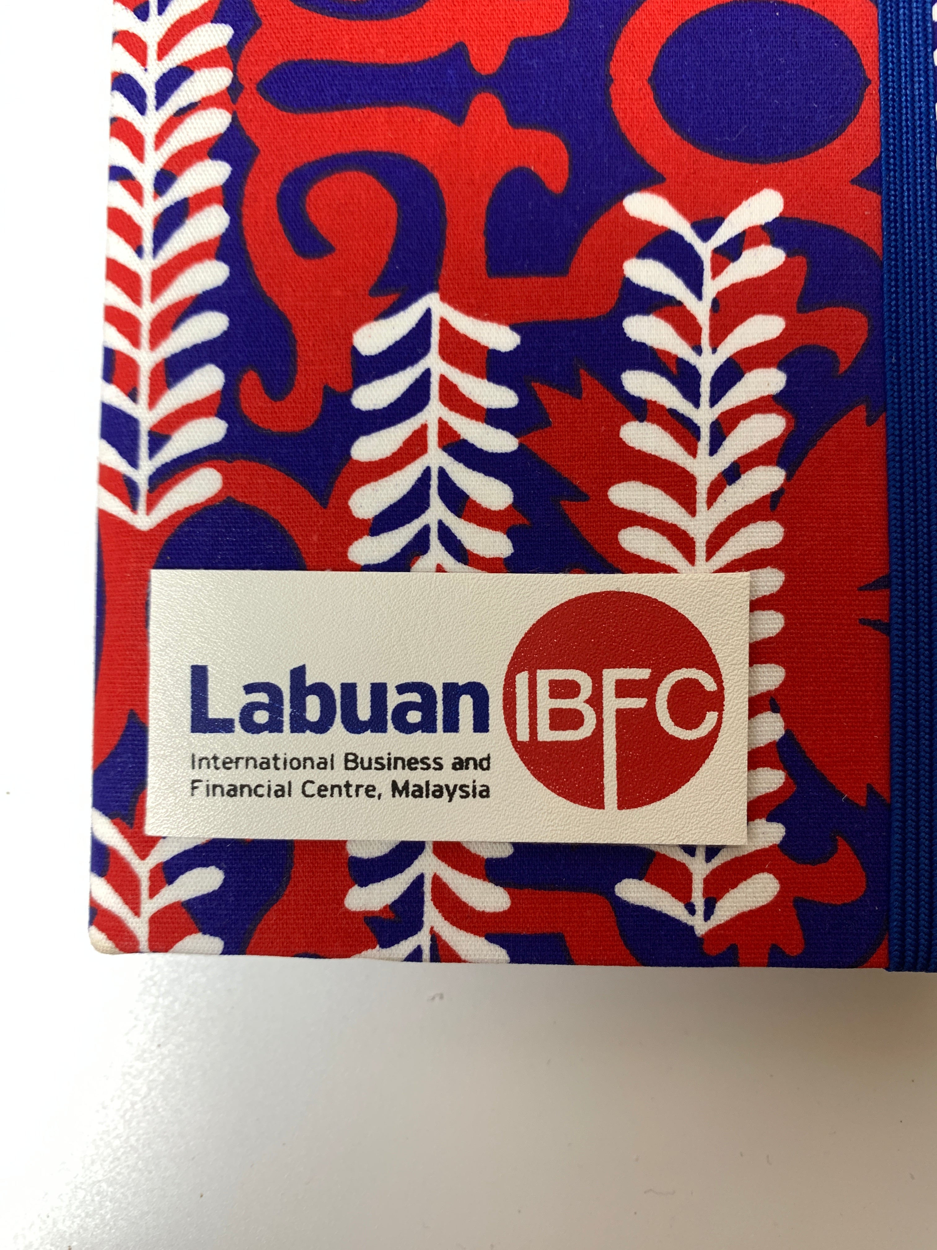 Labuan IBFC International Business and Financial Centre logo on a colorful patterned background