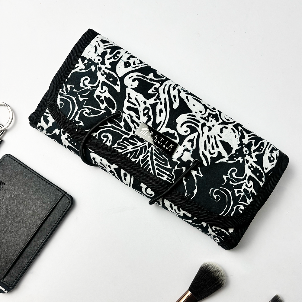 Batik Roll-Up Travel Pouch in  Black Floret show in lifestyle photo 