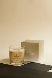 Mangosteen candle and packaging on a neutral background