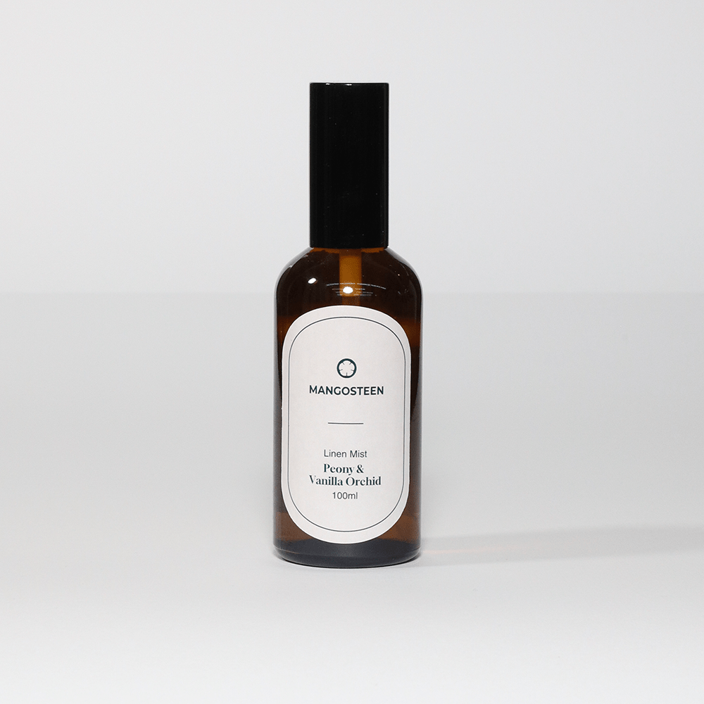 Bottle of Mancosteen perfume on a white background