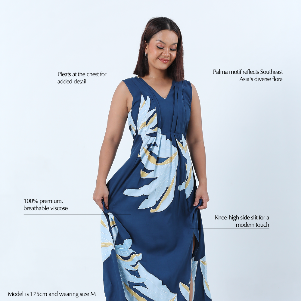 a woman against a white background modeling in a batik dress in the pattern ocean palmera