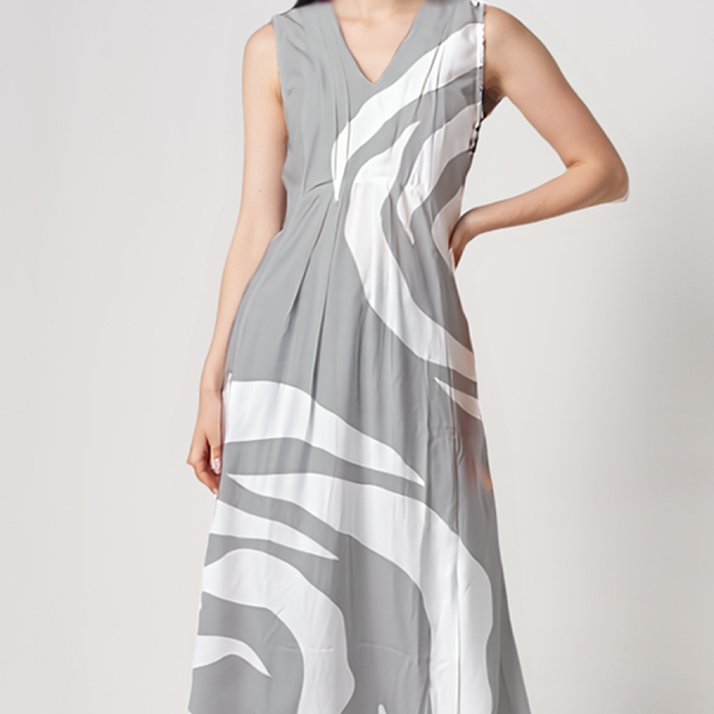 Close-up of  Batik Boutique’s Silver Rose sleeveless batik dress highlighting pleated , and breathable viscous fabric.