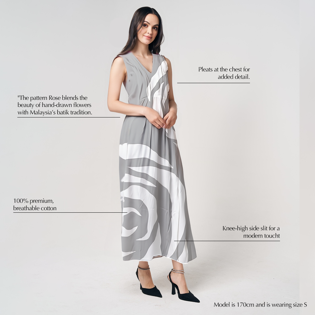 Batik Boutique’s Silver Rose dress showing V-neckline and delicate pleats with modern batik rose pattern in silver and white tones