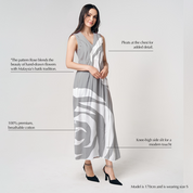 Batik Boutique’s Silver Rose dress showing V-neckline and delicate pleats with modern batik rose pattern in silver and white tones