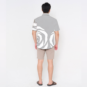 Back view of Batik Boutique’s Silver Rose men’s batik shirt showing modern abstract rose pattern placement in soft silver and white tones.