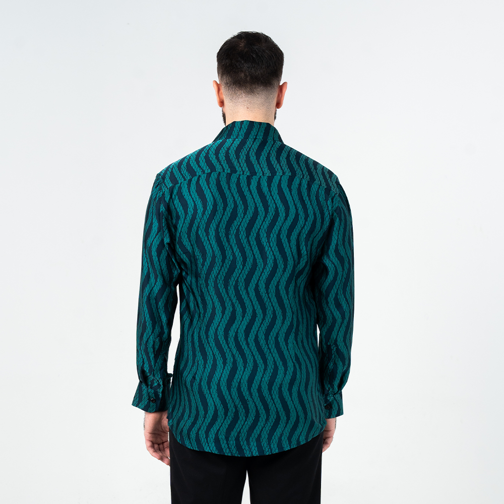 Back view of men's long-sleeved batik shirt in teal Snakeskin print, showcasing the wave-like hand-painted batik pattern.