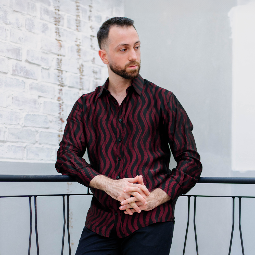 Man wearing Garnet Snakeskin batik shirt styled for modern formal wear