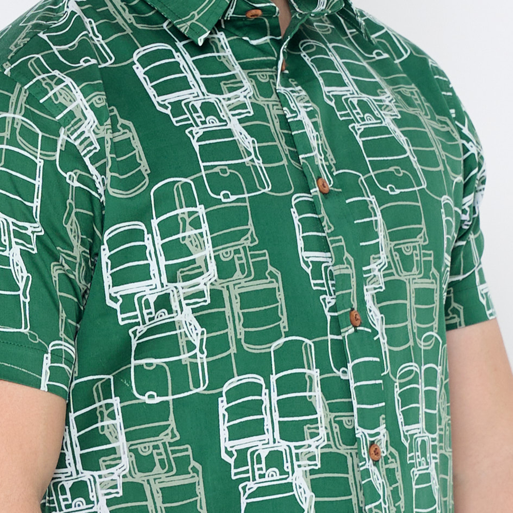 a closeup of batik shirt in the pattern green tiffin against a white background