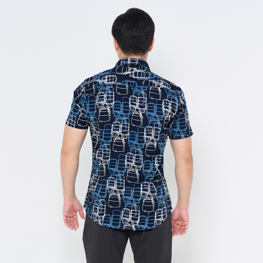 a male model showcasing the back of batik shirt in the pattern navy tiffin 