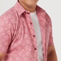 a close up photo of men shirt in pink Bintang pattern