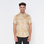 a batik shirt against a white background with mandarin collar in the pattern tan orchid