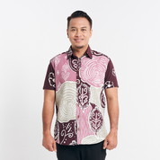 Man in a Maroon Petola batik shirt standing against a white background, displaying front details