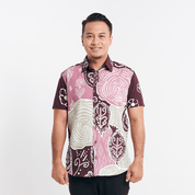 Man in a Maroon Petola batik shirt standing against a white background, displaying front details