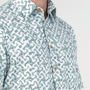 Close-up of collar and chest details on teal Arabesque batik shirt.