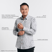  Studio shot with text overlays highlighting the features of long sleeved batik shirt