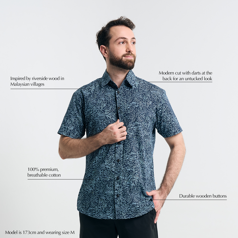 Studio shot with text overlays highlighting features of Navy Driftwood batik shirt