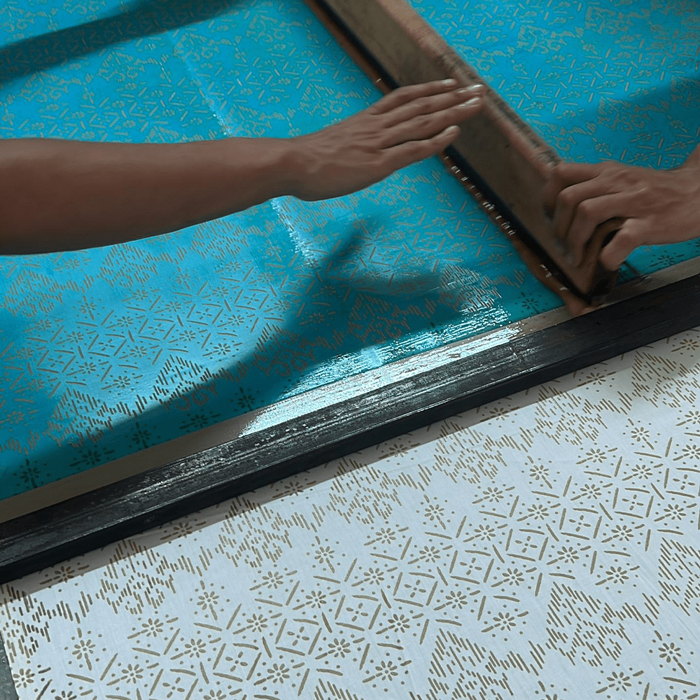 artisan photo of the Men's Long-Sleeved Batik Shirt - Olive Anyam being made 