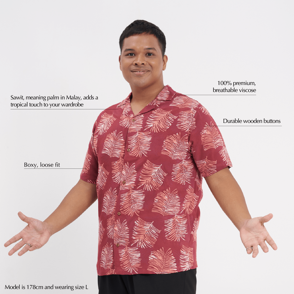 Man wearing a red patterned shirt with text on a white background