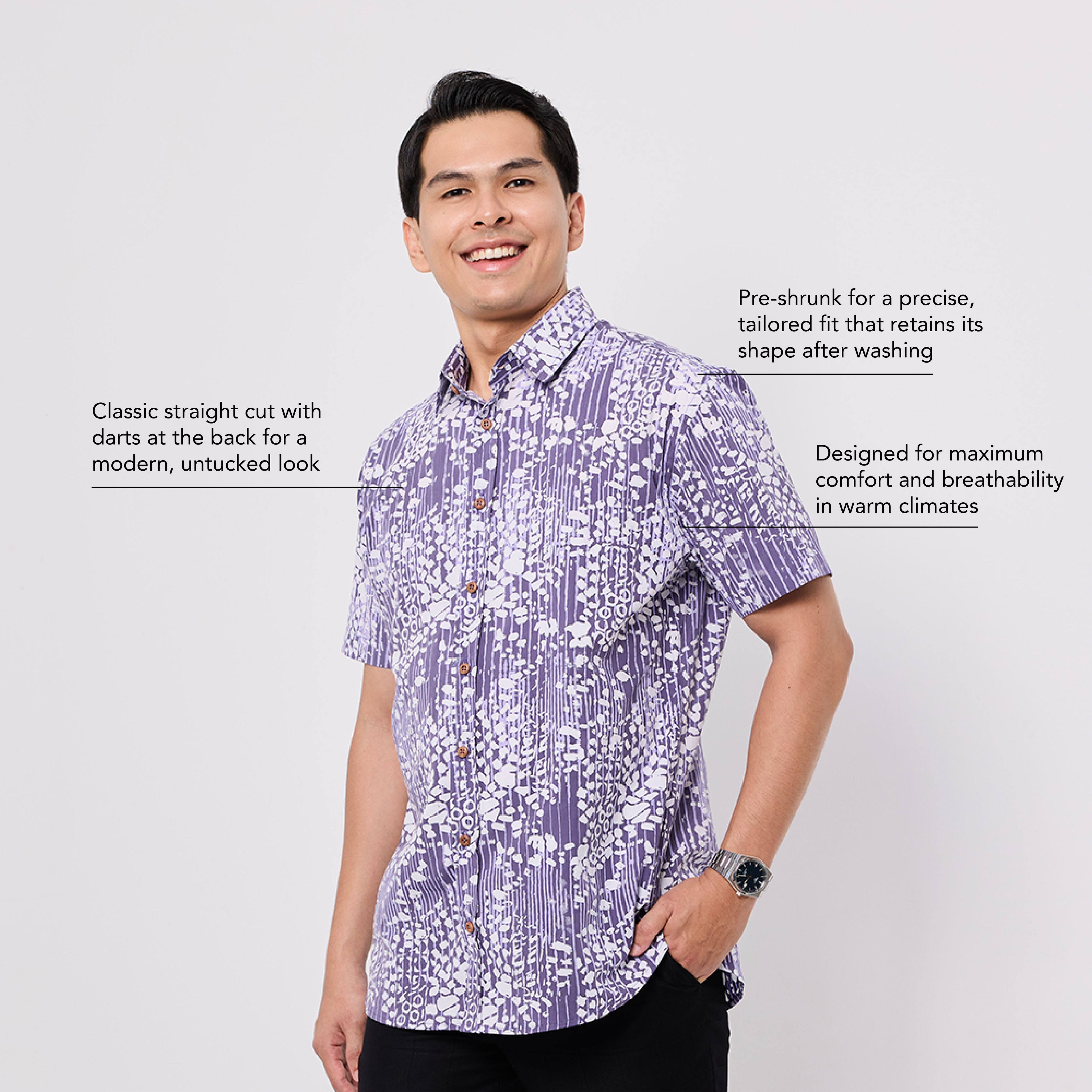 Man wearing a purple patterned Batik shirt on a white background