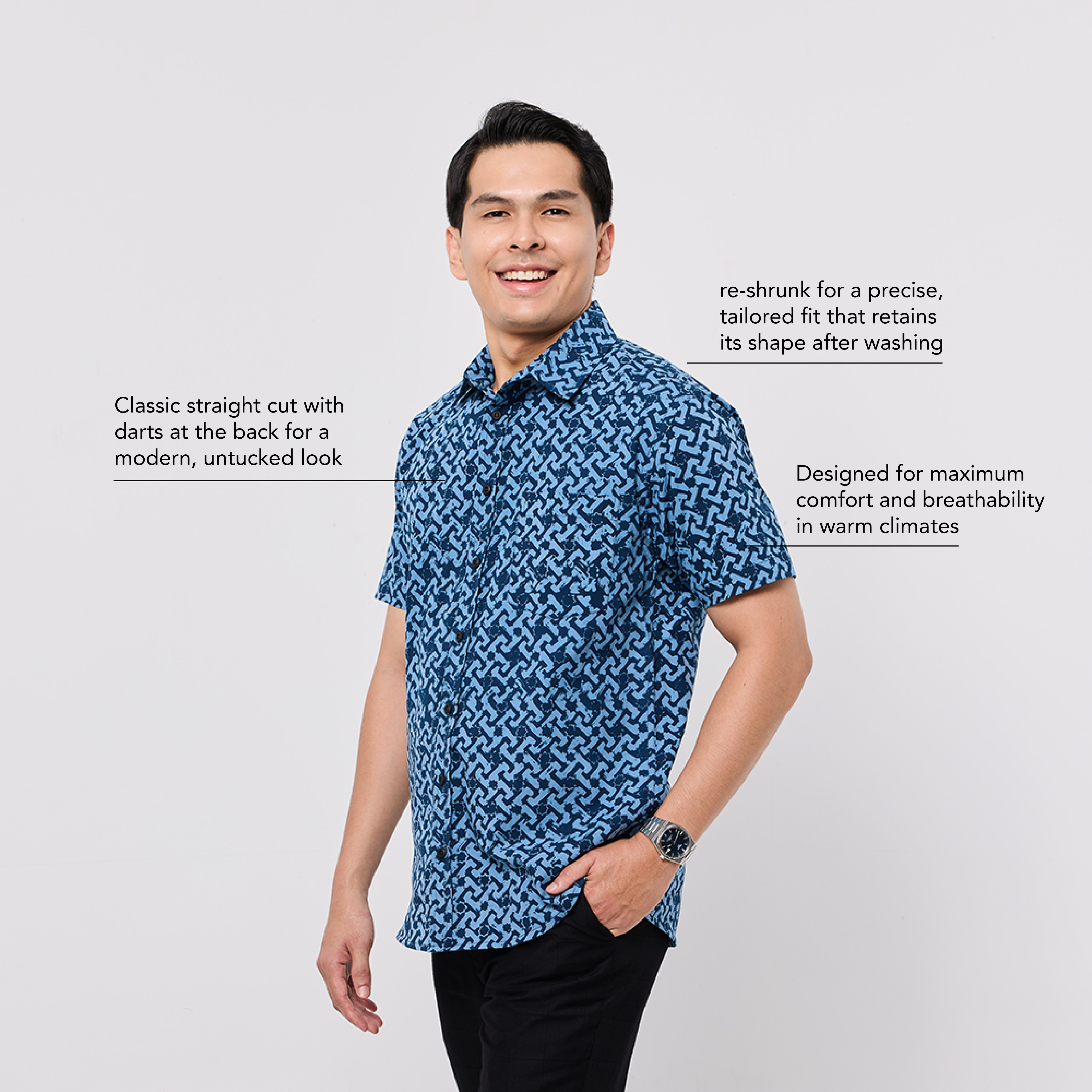 Man wearing a blue patterned shirt on a white background