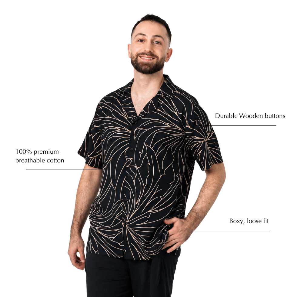 black wearing batik shirt with blue leaf-like patterns