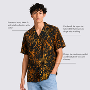 Man wearing black and orange printed shirt with details around