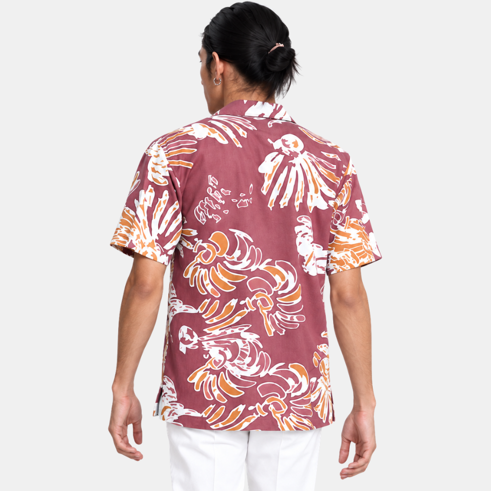 Man showing rearside of maroon shirt