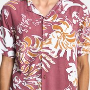 Closeup of man wearing maroon shirt
