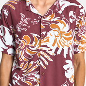 Closeup of man wearing maroon shirt