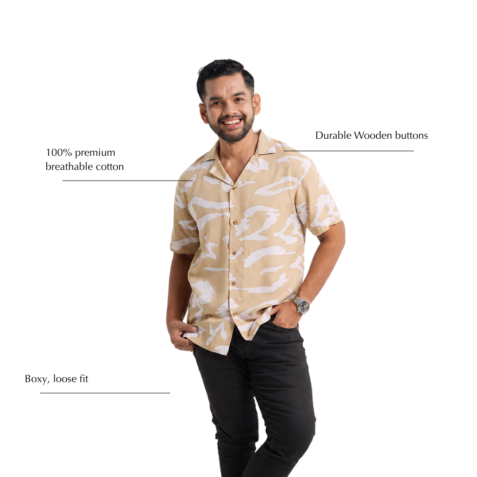 Man wearing batik shirt with beige patterns