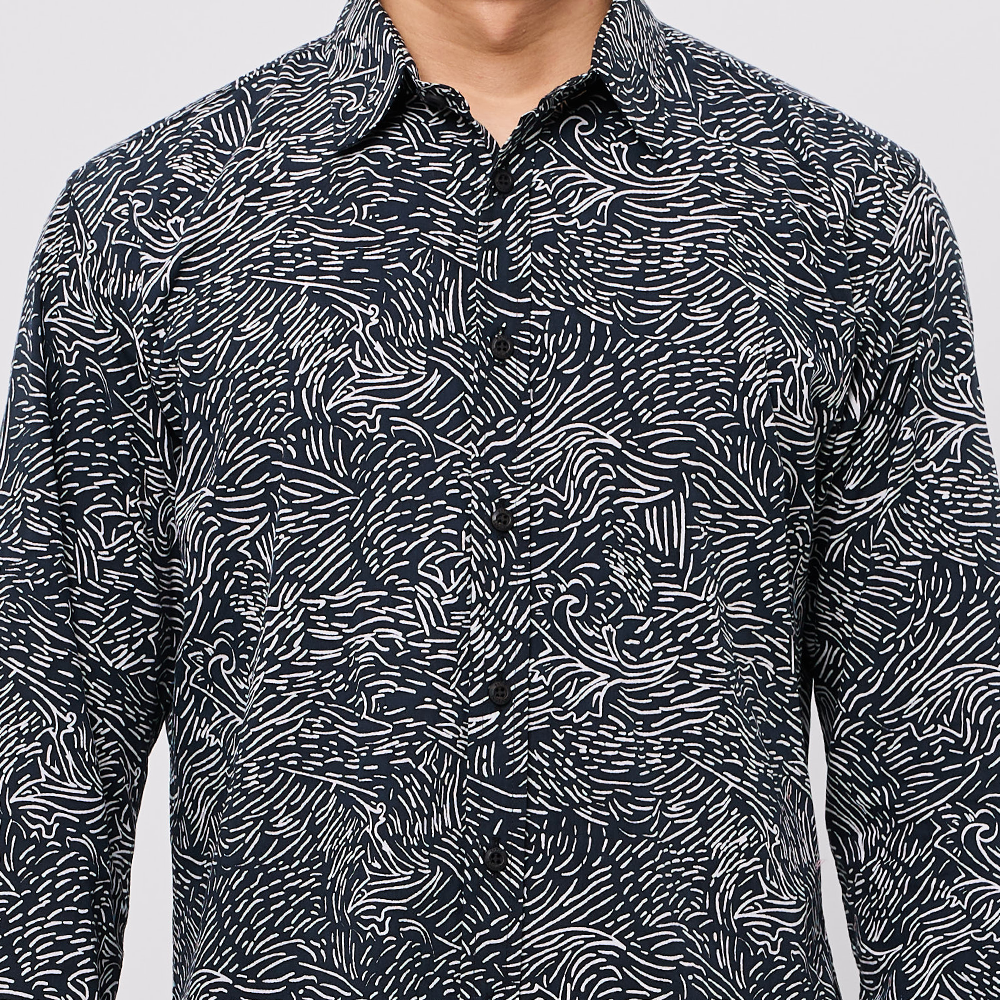 Black and white patterned shirt on a plain background