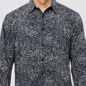 Black and white patterned shirt on a plain background