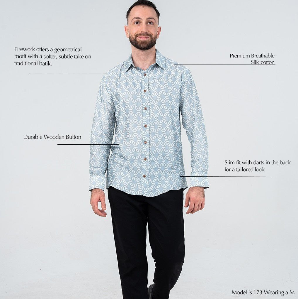 Man wearing a light blue patterned shirt with text describing features on a white background