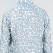 Light blue geometric patterned shirt on a light gray background