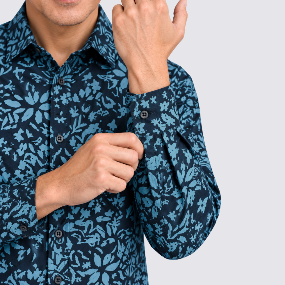 Closeup of man wearing blue printed batik shirt