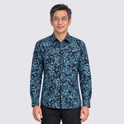 Man wearing blue printed batik shirt facing front