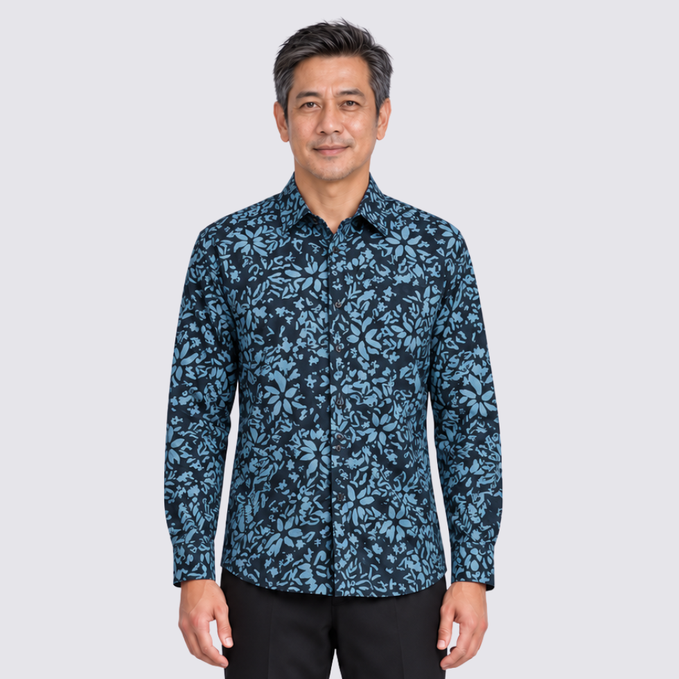 Man wearing blue printed batik shirt facing front