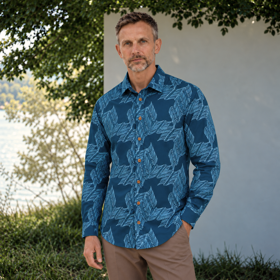 Man wearing blue printed batik shirt standing outside