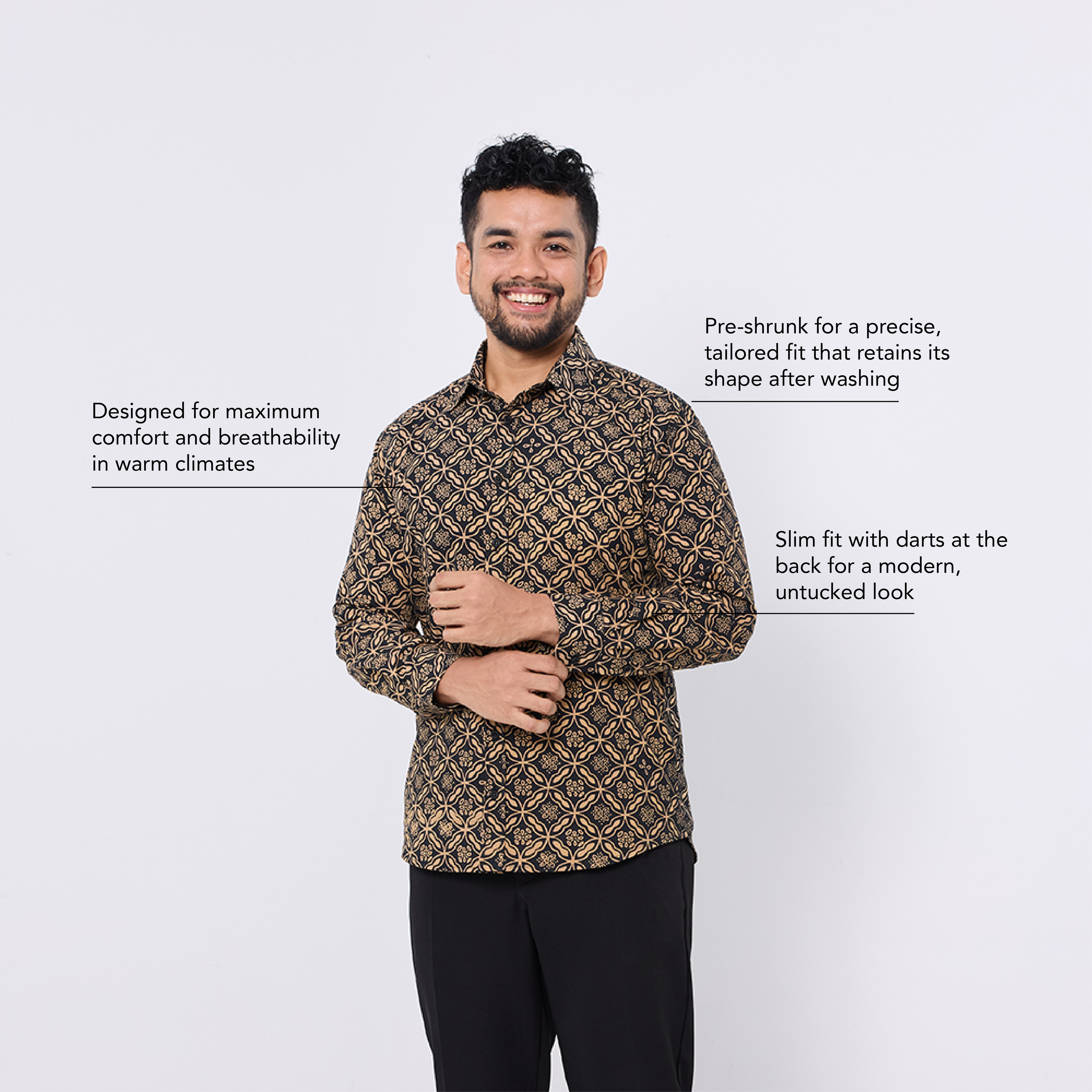 Man wearing a patterned shirt with text about shirt features on a white background