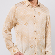 Beige patterned shirt worn by a person on a light gray background