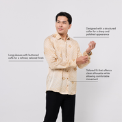 Man wearing a beige patterned shirt with text describing its features on a white background