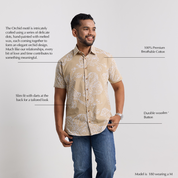 Man wearing a patterned shirt with text describing its features on a light gray background