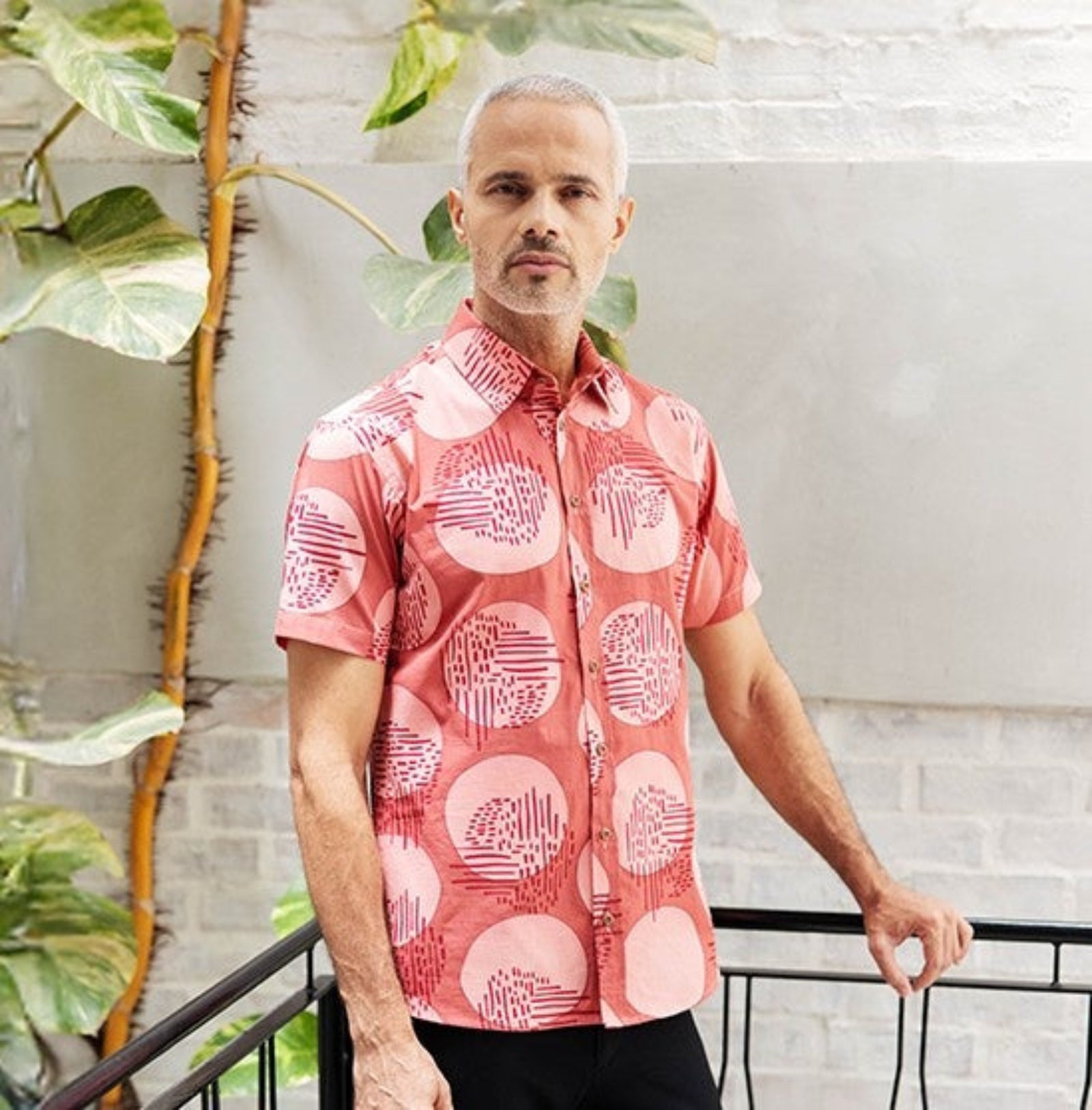 Man wearing Crimson Yuan Dian short sleeved shirt 