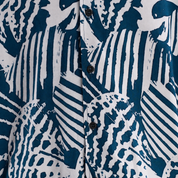 Close up of the blue printed batik shirt with black buttons