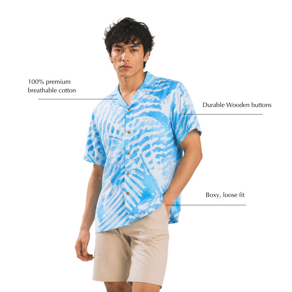 Man wearing batik shirt with blue shell-like patterns