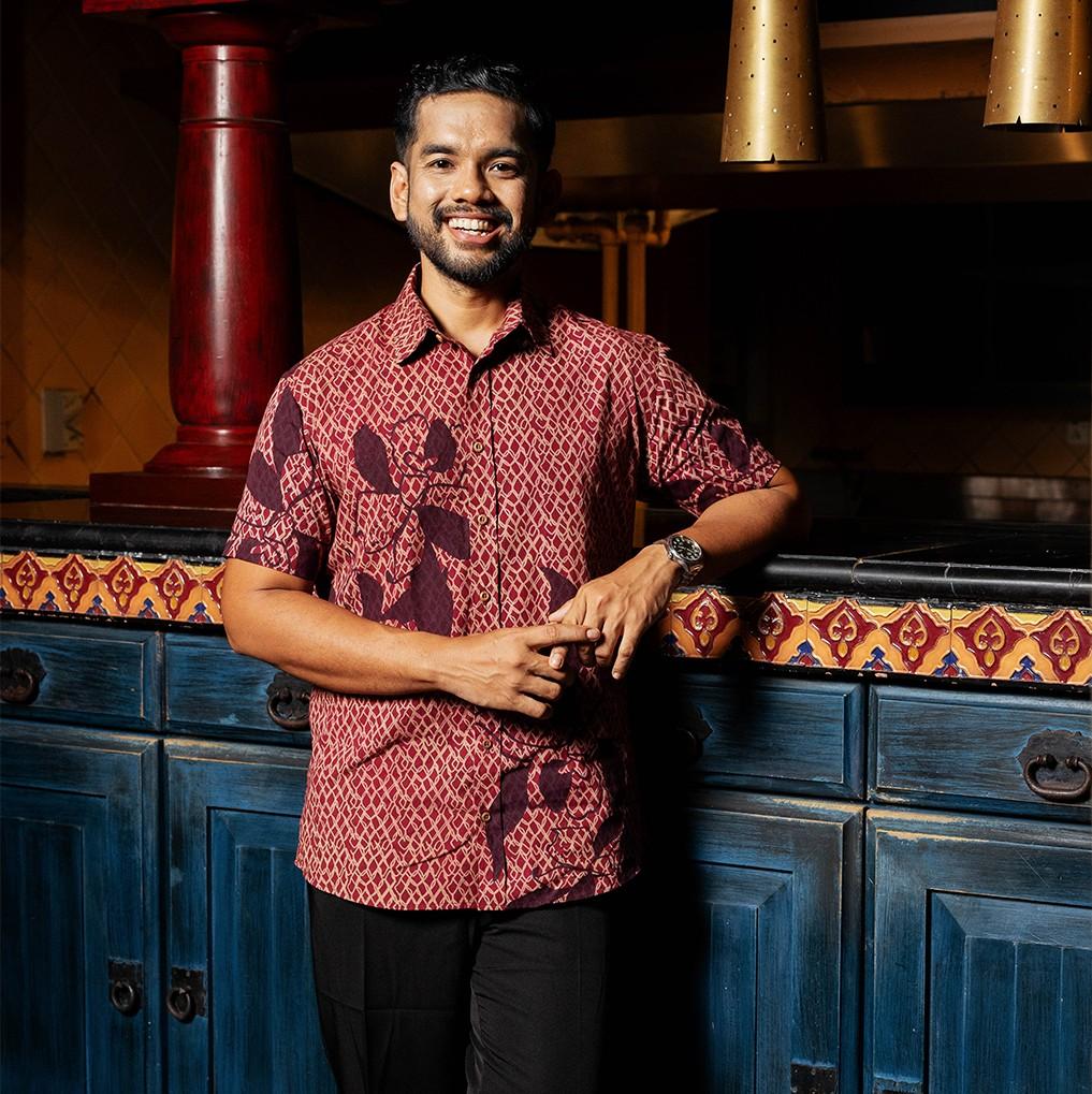 man wearing the copper blooming lace shirt in a fancy setting demonstrating the versatility of this classy shirt 