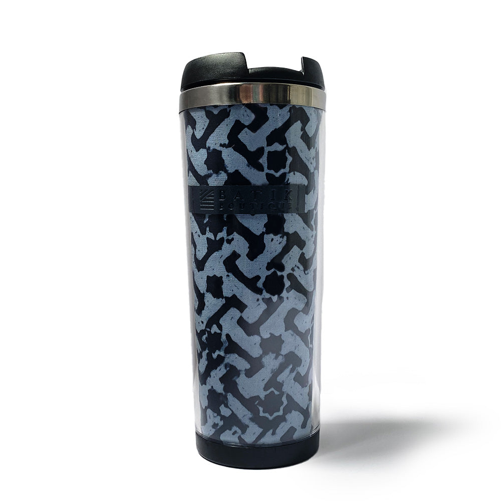 a photo of a tumbler made of batik in the midnight arabesque pattern 