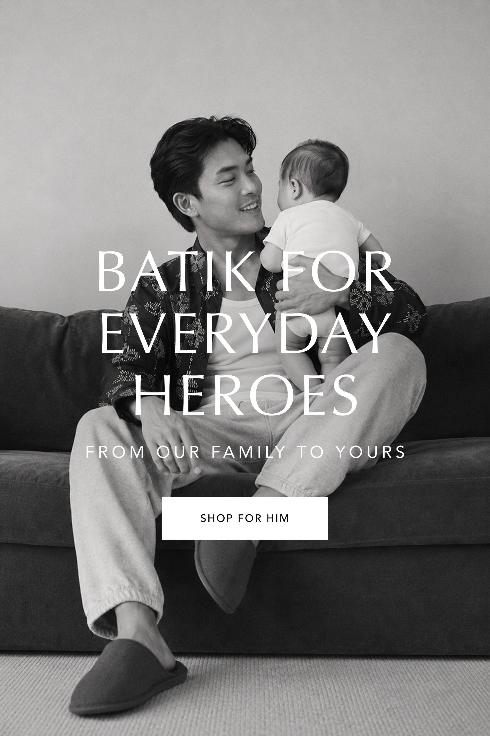 Man holding a baby on a couch with promotional text overlay