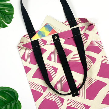 a lifestyle photo of batik inspired totebag in nasi lemak pattern in fuchsia color